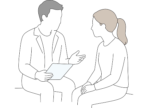 A specialist consulting with a patient