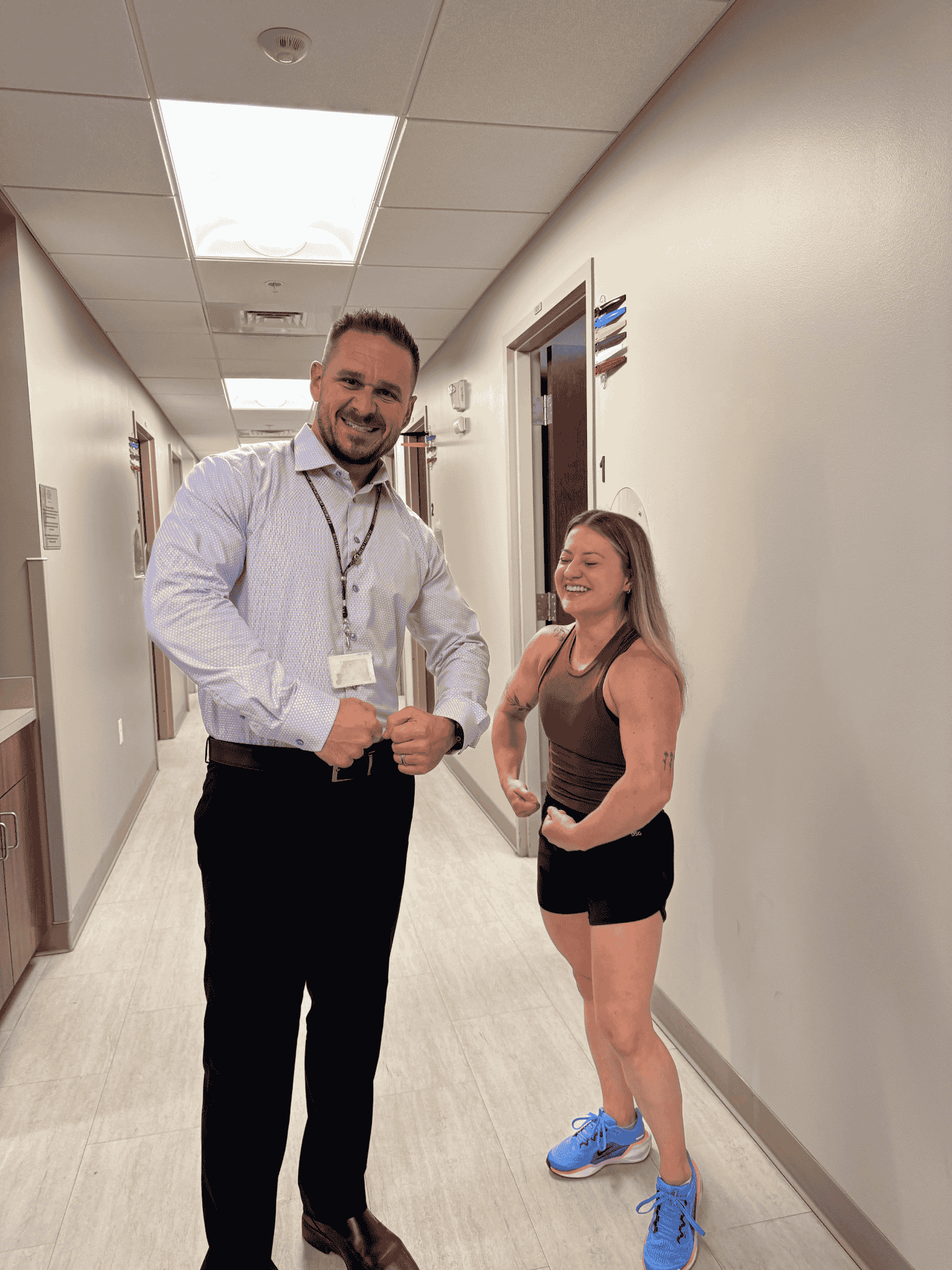 patient and doctor flexing after physical therapy