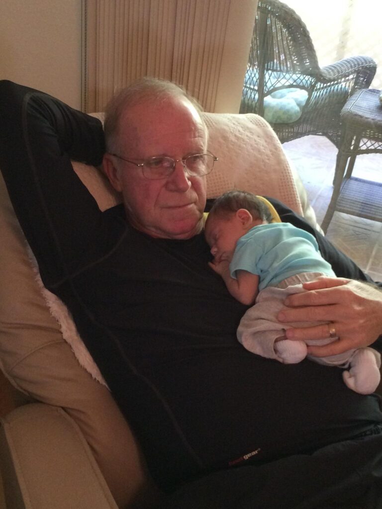 Patient holding his granddaughter