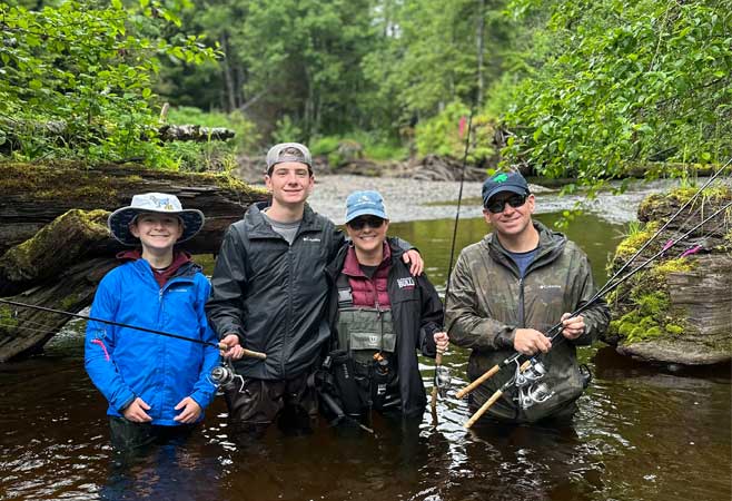 Anthony Hudson fishing with his family