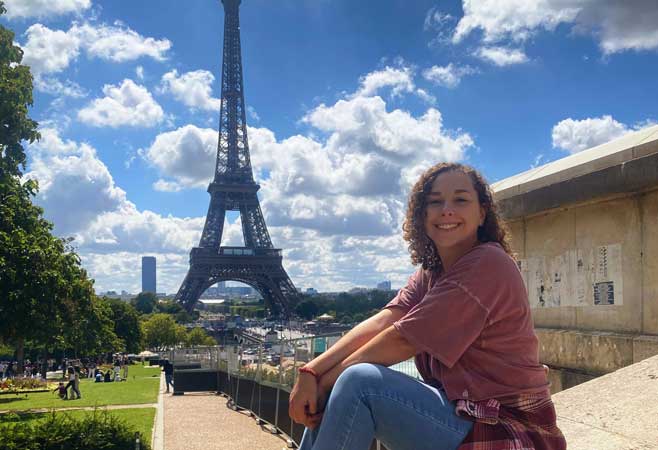 Elizabeth Zucker next to Eiffel Tower