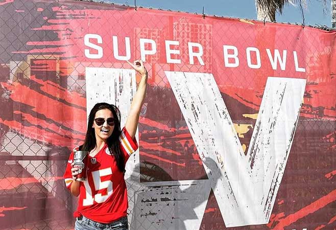 Katherine Hicks in front of a Super Bowl LV sign