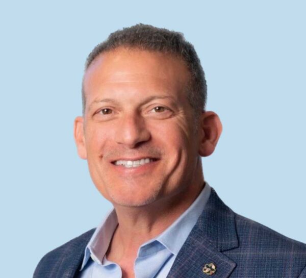 Paul Pagano, MD professional headshot wearing blue suit jacket.