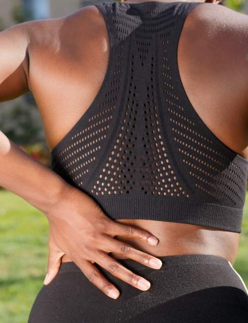 woman athlete back pain